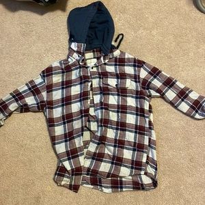 This is an American eagle flannel, the hood comes off if you want it to.